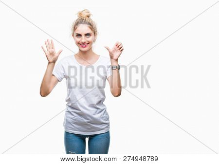 Young beautiful blonde woman wearing white t-shirt over isolated background showing and pointing up with fingers number six while smiling confident and happy.
