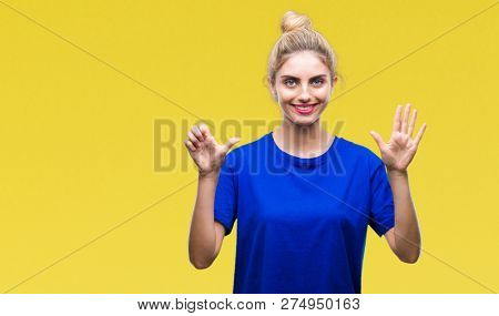 Young beautiful blonde and blue eyes woman wearing blue t-shirt over isolated background showing and pointing up with fingers number six while smiling confident and happy.