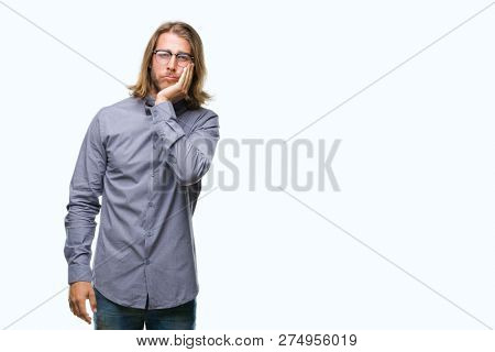 Young handsome man with long hair wearing bow tie over isolated background thinking looking tired and bored with depression problems with crossed arms.