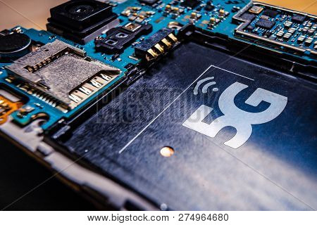 Disassembled Mobile Phone Or Smartphone Without A Back Cover, And 5g Or Lte Word Printed In Circuit 