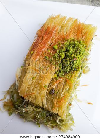 Turkish Dessert Hasir Tandir Kadayif With Pistachio And Cheese. Traditional Dessert.