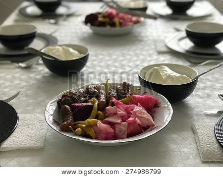 Turkish Pickle With Yogurt At Lunch Table.