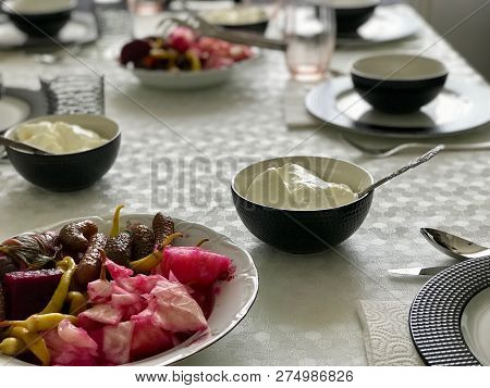 Turkish Food Yogurt With Pickle At Dinner Table.