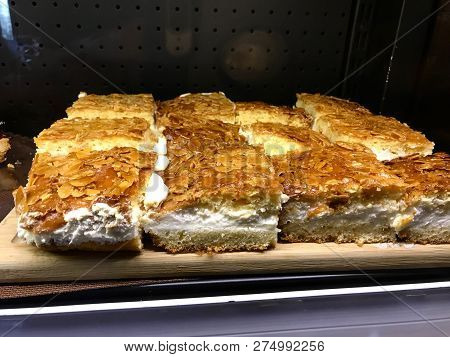 German Cake Nussecken Sweet Nut Pastry Cut In Square And Cream Filled. Traditional Dessert.