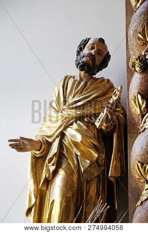 RETZBACH, GERMANY - JULY 04, 2018: Saint Peter statue on the Beheading of John the Baptist altar in Maria im Grunen Tal pilgrimage church in Retzbach in the Bavarian district of Main-Spessart, Germany