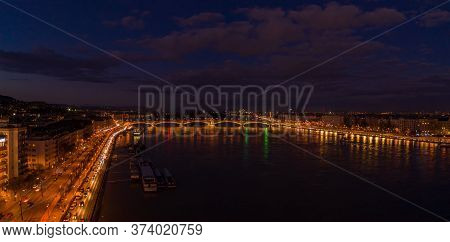 Aerial Drone Shot Of Danube River With Magaret Bridge In Budapest Evening