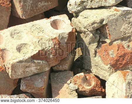 Broken Bricks Lie In A Pile In A Construction Waste Dump