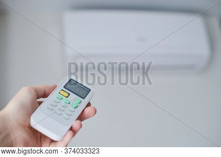 Remote Control For Air Conditioner In Hand. Room Condition Remote Control. Air Temperature Switch Fo