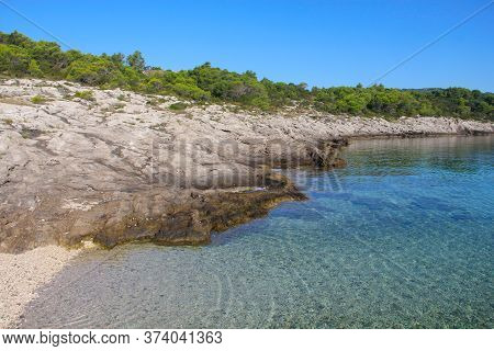 Turquoise Sea Water White Stone Beach And Mountains, Sumartin, Brac Island, Croatia