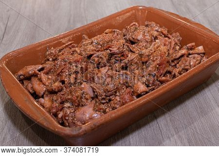 Squid With Tomato On A Clay Pot