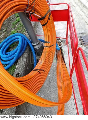 Orange Pipe For Laying The Optical Fibers To Connect Companies And Families On The Internet
