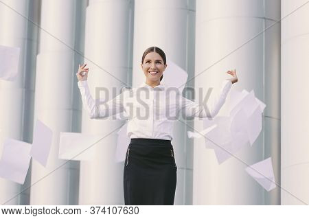Beautiful Cheerful Girl Student Lawyer Celebrate Success And Throw Documents Away In Air Outdoors. Y