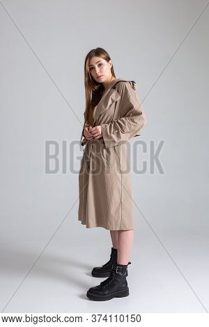 Attractive Caucasian Skinny Girl With Long Hair Posing On White Cyclorama. Beauty Portrait, Model Te