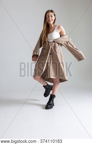 Attractive Caucasian Skinny Girl With Long Hair Posing On White Cyclorama. Beauty Portrait, Model Te