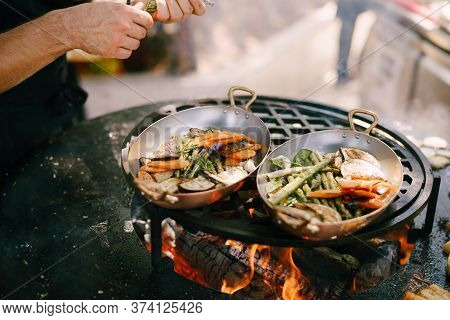 The Chef Roasts The Vegetables On The Grill.