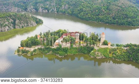 Aerial View On Czech Medieval Castle Zvikov, Situated On Rocky Outcrop Above The Confluence Of Two R