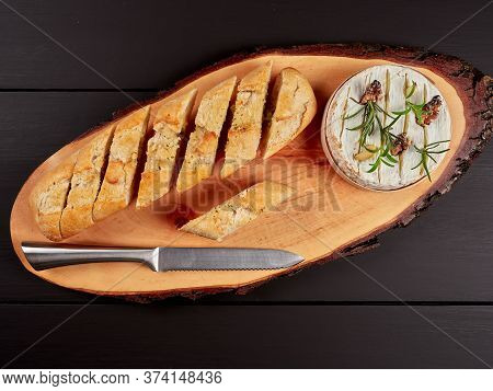 Baked Camembert With Walnuts, Rosemary Stalks And Garlic Cloves, Served With Crusty Garlic Gread, On