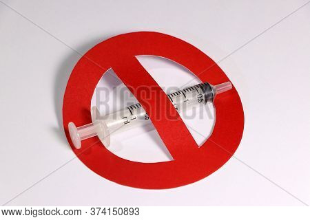 A Syringe With Symbolic Of Anti In Red Color On White Background.