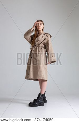 Attractive Caucasian Skinny Girl With Long Hair Posing On White Cyclorama. Beauty Portrait, Model Te