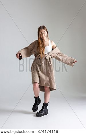 Attractive Caucasian Skinny Girl With Long Hair Posing On White Cyclorama. Beauty Portrait, Model Te