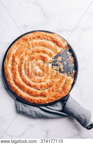 Filo Spinach And Feta Twist Pie In The Iron Pan After Oven. Authentic Greek Bakery. With Spinach, Mi