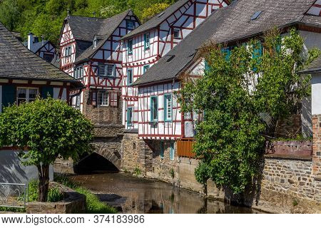 River Elz With Old Bridge And Half-timbered Houses In Monreal, Germany
