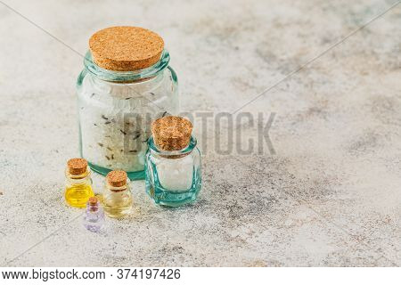 Aromatic Oils In Glass Bottles, Aromatic Salts And Dry Lavender. Concept Natural Ogranic Skincare Co