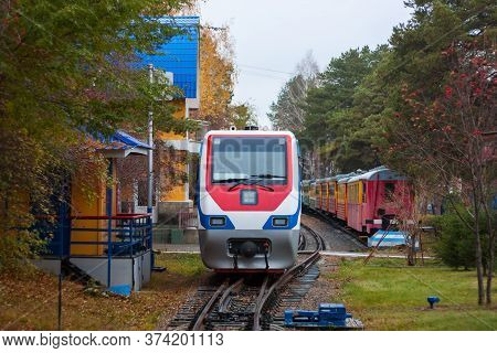 Narrow Gauge Train In The Autumn Park