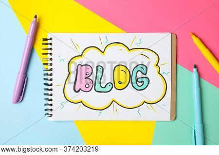 Notebook With Drawing Blog On Multicolor Background