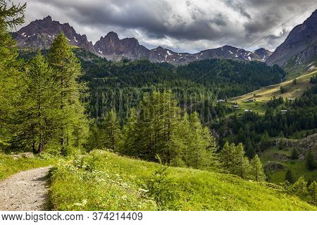 Footpath In Alps  In Claree Valley In Hautes Alpes, Nevache, France. In The Background There Is The 