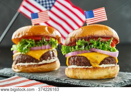 4th of july themed cheeseburgers with mini flags