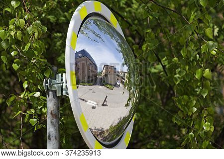 Umea, Norrland Sweden - June 10, 2020: A Convex Traffic Mirror Where You Can See Parts Of The Campus