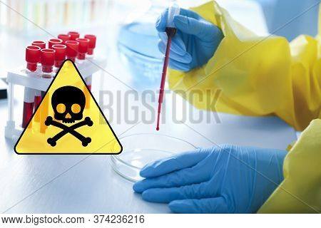 Poison Sign And Scientist Dripping Blood Sample Into Petri Dish At Table, Closeup