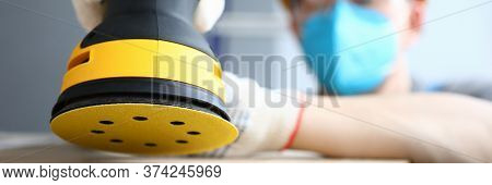 Masked Builder Polishes Sander Wooden Surface. Rotational And Oscillatory Movements Equipment. Elect