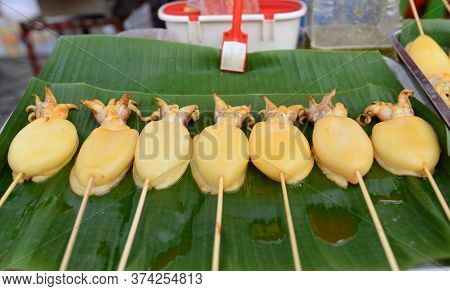 Squid Carapace, Skewers Placed On A Green Banana Leaf For Sale