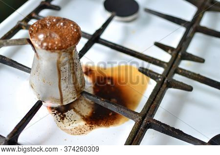 Spilled Cezve Of Coffee On Gas Stove