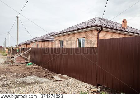 Brick House Wall Facade. Construction Of Houses. Cottage Red Brick House