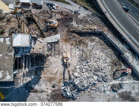 Aerial View Of Building House Demolition And Construction Site Excavator With Hydraulic Crasher Mach