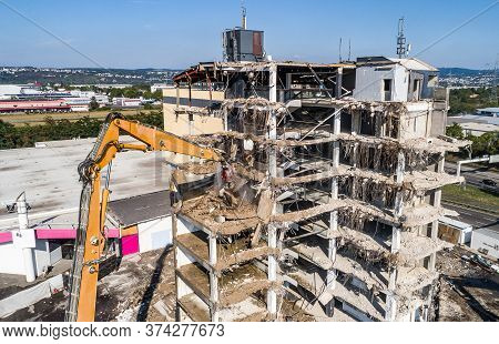 Aerial View Of Building House Demolition And Construction Site Excavator With Hydraulic Crasher Mach