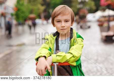 Portrait Of Cute Ten Years Old Boy Outdoors. Handsome Kid Walking City Street. Kids Fashion, Lifesty