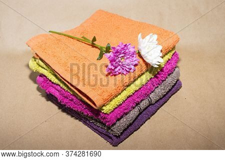 Some Facecloths Off Various Shades With Flowers