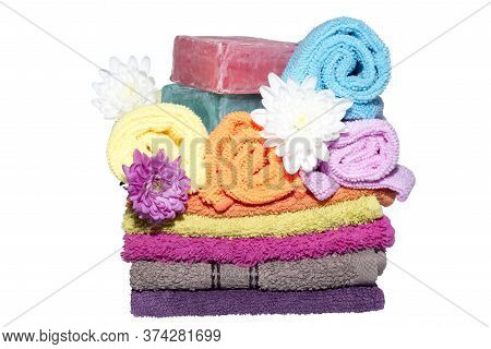 Soap Bars On Facecloths Off Various Shades With Some In Rolls And Flowers