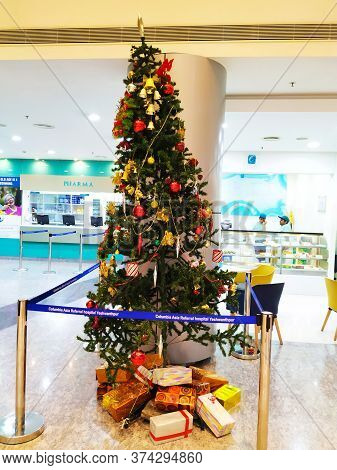 Beautiful View Of Christmas Tree Decoration With Bell, Gift Box And Star. Done At Entrance Of Columb