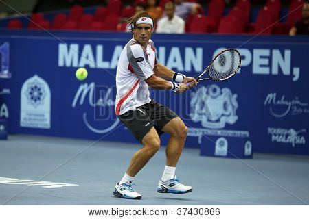 KUALA LUMPUR - 27 SEP: David Ferrer van Spanje speelt zijn eerste ronde 2 match in de ATP Tour Malaysian Open 
