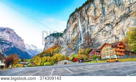 Stunning Autumn View Of Lauterbrunnen Village With Awesome Waterfall  Staubbach  And Swiss Alps In T