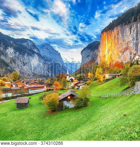 Dramatic Autumn View Of Lauterbrunnen Valley With Gorgeous Staubbach Waterfall And Swiss Alps At Sun
