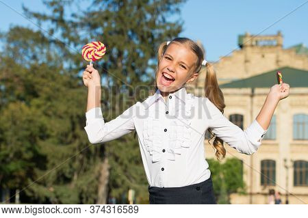 Toothsome Dessert. Happy Dessert Girl Hold Lollipops. Little Child Enjoy Dessert Summer Outdoors. De