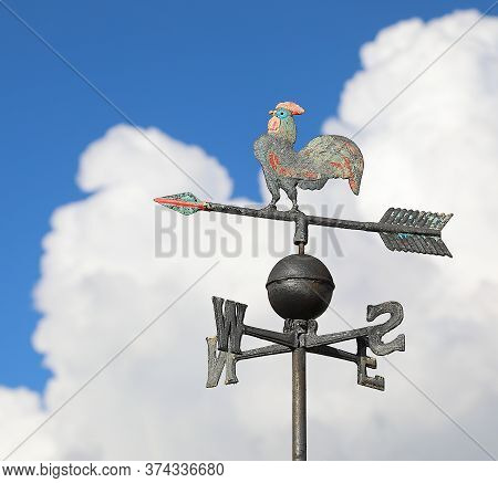 Metallic Rooster Of A Wind Vane To Indicate The Wind Direction With The Cardinal Points North South 