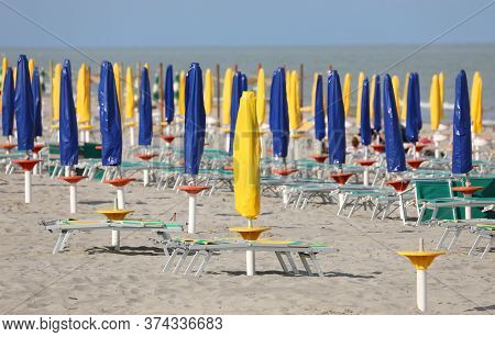 Closed Umbrellas In The Bathhouse Without People Because There Is Coronavirus Outbreak And The