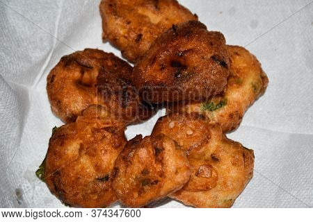 South Indian Cuisine- Very Oily Medu Vadai Or Vada Kept On Kitchen Tissue. Very Popular South Indian